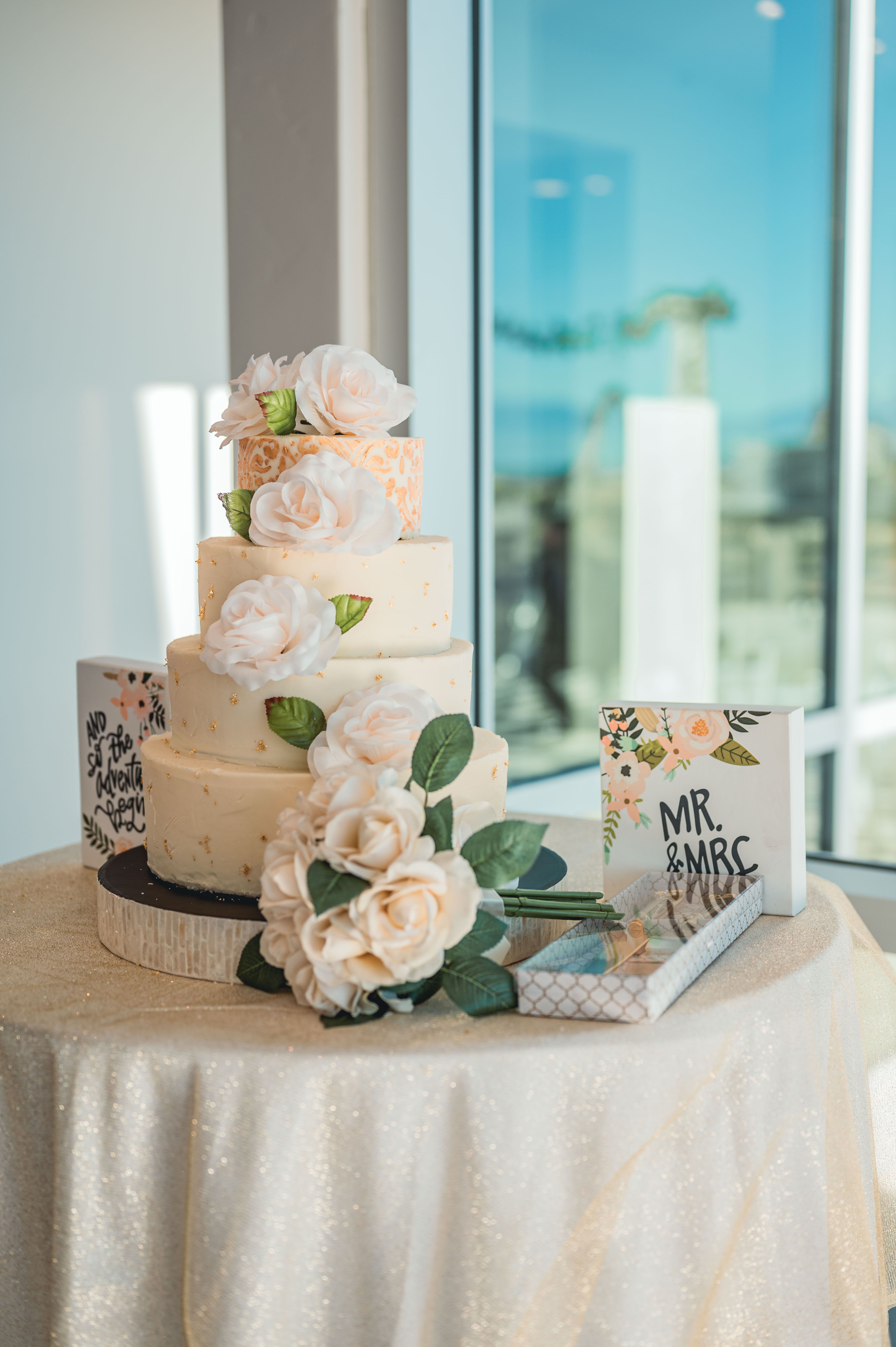 Cream wedding cake, blush roses